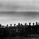 Luftwaffe Air Marshall Hermann Göring (sixth from right, facing left) and his staff, gathered on the coast of France, contemplate the white cliffs of Dover across the English Channel